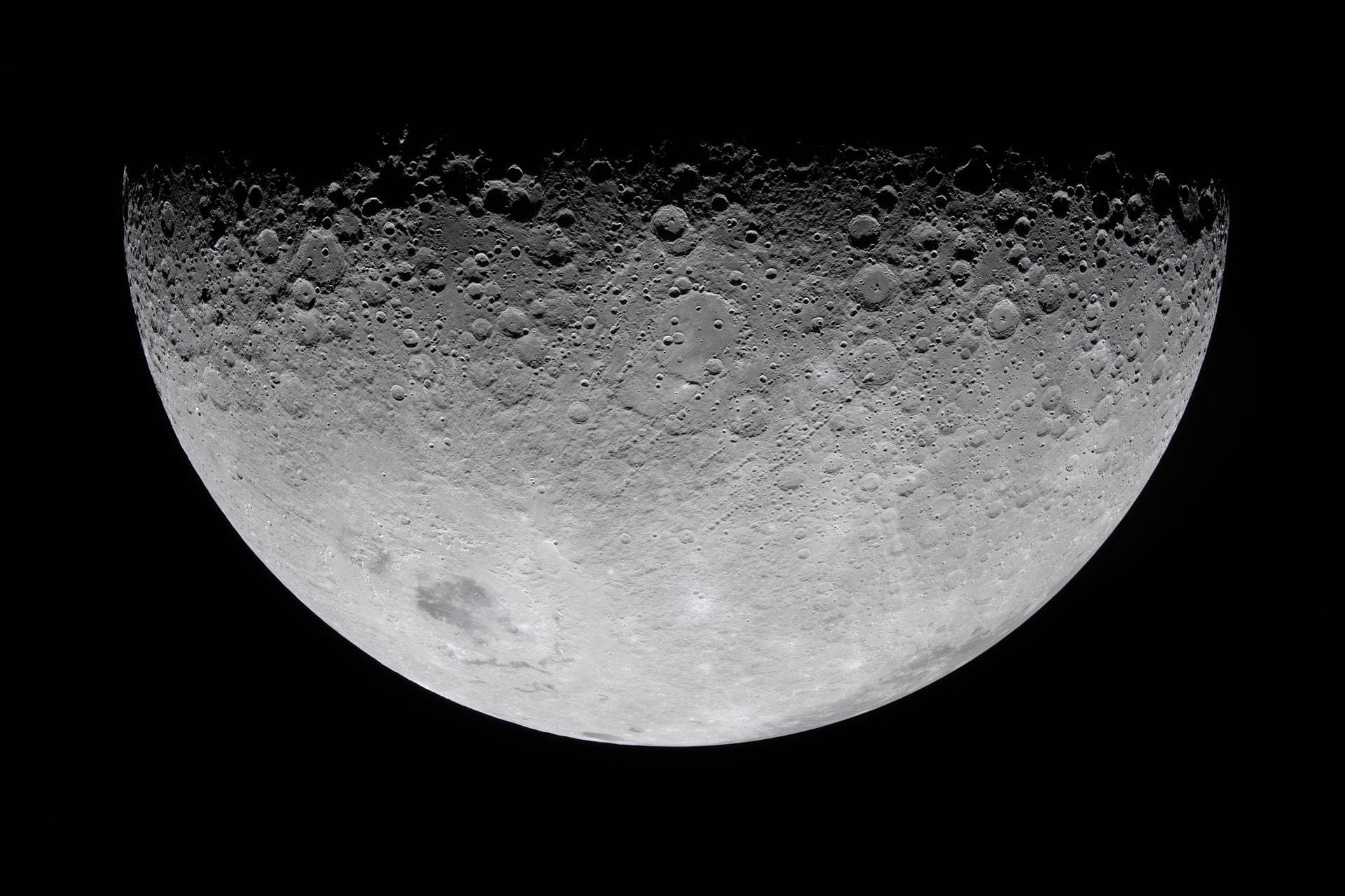Cratered lunar hemisphere on black