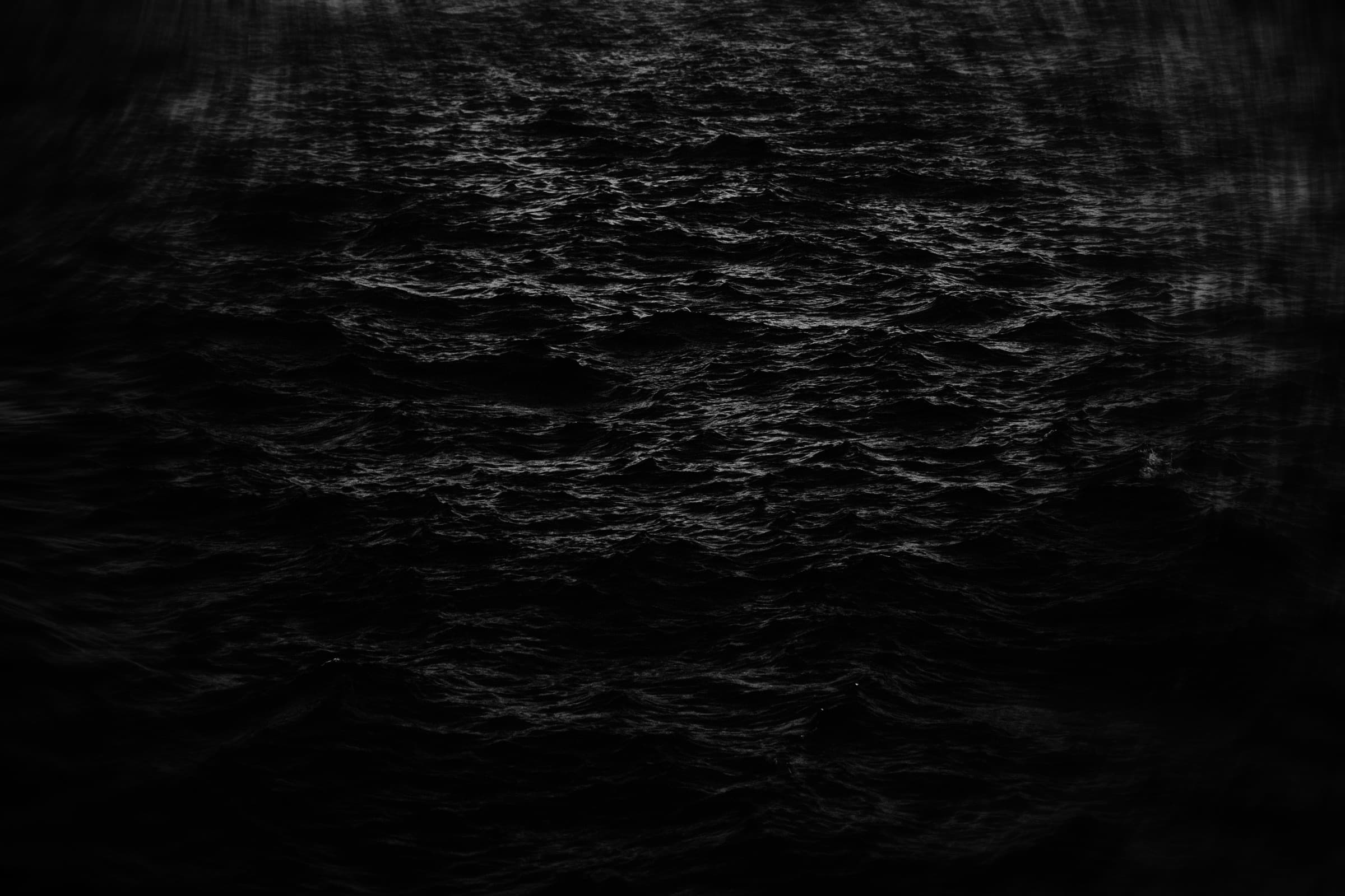 Dark ocean surface at night
